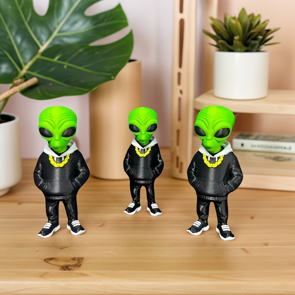 1 stuk groene alienfiguur met  - Desk Setup Home Office recensie en prijs